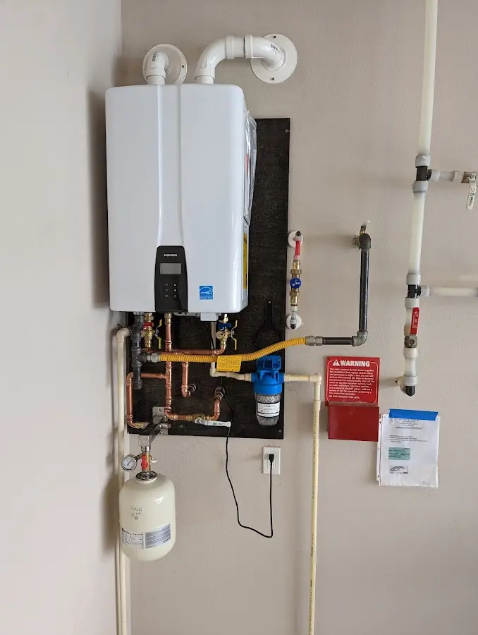 Professional plumber installing copper piping in a Orchidlands Estates home